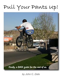 A BMXer sitting on his bike jumping high above a low wall towards a street